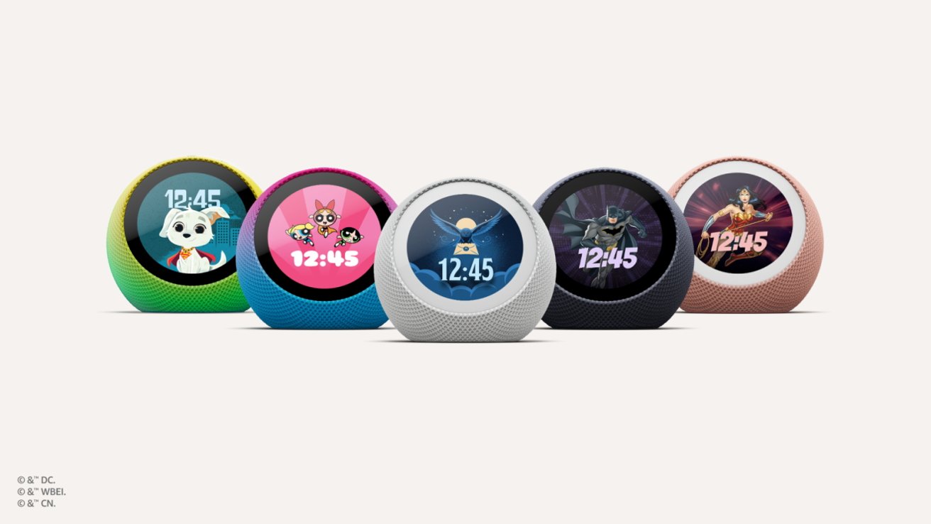 Five colorful round smart displays for kids, each showing a different cartoon character and the time 12:45, arranged in a row against a plain light background. — Picture from apple
