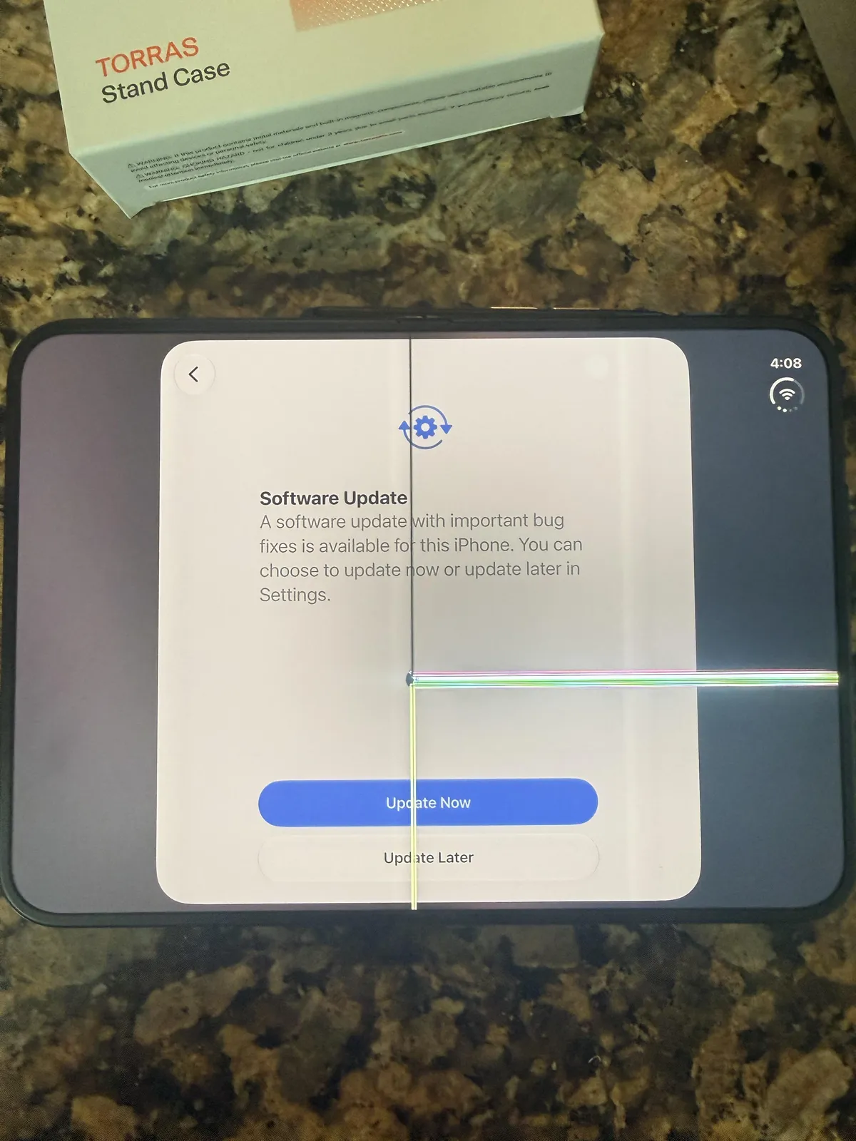u/leftyhyzer16, during setup. He wrote that about four folds made the hinge tighten, then pop. A line runs down the crease, and a thin bright line runs across the software-update screen.