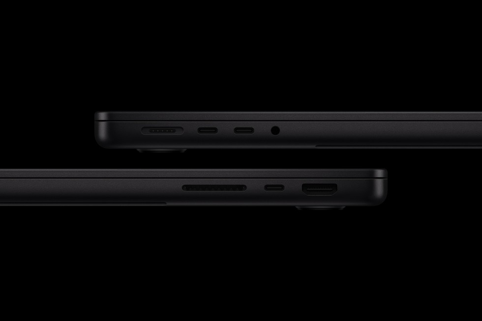 Space black, from the side. MagSafe 3, USB-C ports, a headphone jack, an SDXC slot, and HDMI. On the M6, Apple lists the USB-C ports as Thunderbolt 4.